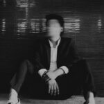 man sitting on floor